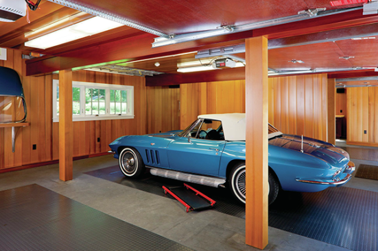 The floor of the garage has radiant heating in a new concrete slab that's colored with Scofield (scofield.com) powder colorant. The walls are vertical cedar. The Platt team also custom-built new cabinets for the workshop.