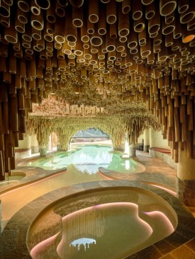Caption: Regenerate, the spa and indoor-outdoor swimming pool, featuring decorative ceiling by Francis Kéré and pool designed by Nachson Mimran.