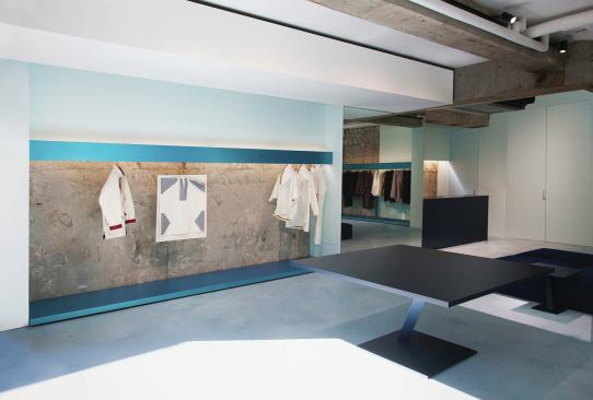 The architects went through many color combinations before settling on green and blue for the aluminum clothing displays, because, Yoshioka says, those colors “maximally evoke the texture of collections which will be contained at the store.” Blue racks are confined to the upper level. 