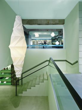 Yoshioka was interested in “incorporating the trace of time cultivated in the space,” he says. The view from the stairwell drives home, as Yoshioka says, “the contrast between the texture of peeled wall and futuristic, colored aluminum—the contrast between history and future.”