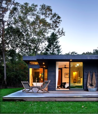 Large
windows and a slightly raised porch from the ground bring the outdoors into the
home.