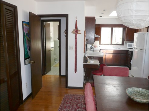 The original kitchen and common area were previously
enclosed, making it difficult to make a cohesive dining area.