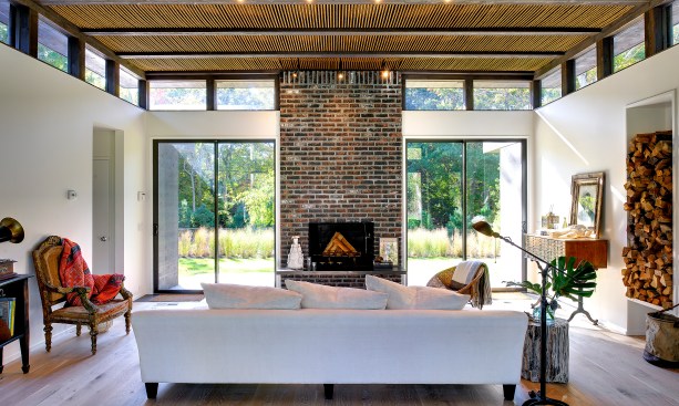 The
new living area is defined by furniture, with the new dining area facing it.