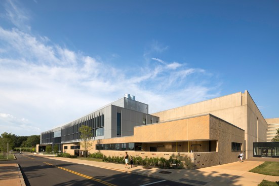 View of the new zinc-and-cast-in-place-concrete addition from the southwest, with the original I.M. Pei structure at right.
