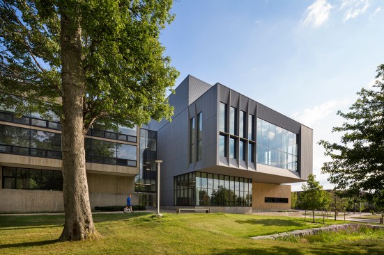 To have the addition (at right) relate to, but stand apart from the existing Pei building (at left), the team inverted the material language from concrete with glass and metal accents to glass and metal with concrete accents. And the dialogue between the two structures extended down to the details: “We took some of the bias window framing Pei had done in concrete, and rendered those in metal,” Biklen says. “There’s a smoothness to the existing building, and in many ways we were pushing that theme with a bit more depth and scale, so there’s monumentality to it but with bit more texture.”