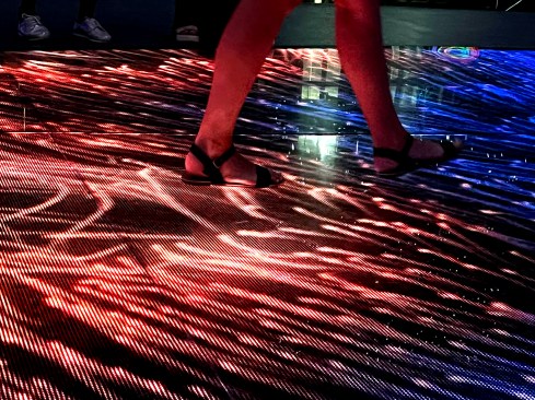 The Russia Pavilion features an expansive interactive floor composed of frameless digital displays of durable glass.