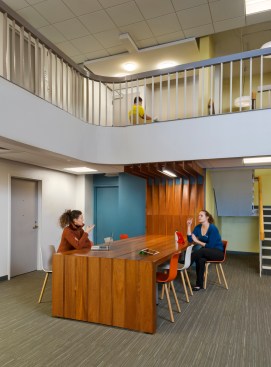 Commons table in Carlin Hall's entry lobby. Contrasting lines and colors heighten spatial awareness, which is helpful to the visually impaired population at Gallaudet.  
