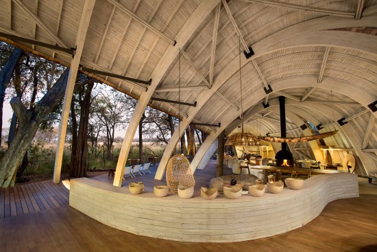 The open-air lounge is topped by the glulam shell and timber.