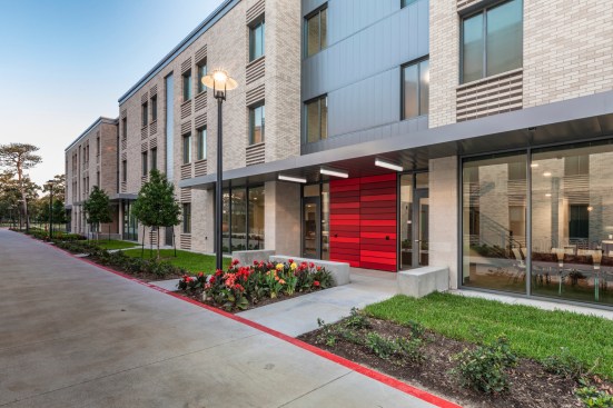 Colorful entrance to one of the Quad’s seven townhouses across a wide pedestrian thoroughfare from The Commons. Courtesy EYP Architecture & Engineering.