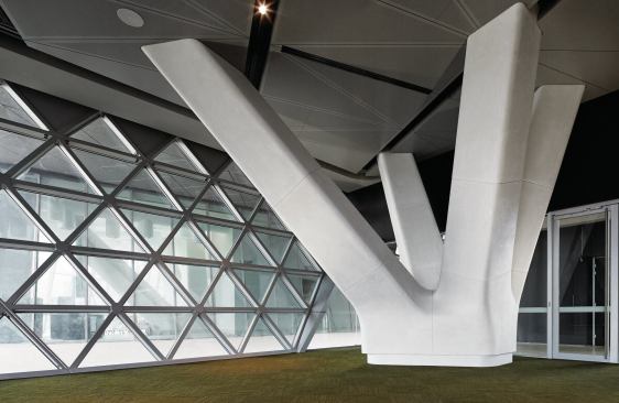 The flower columns at the plaza level transfer column loads from the upper levels to centralized points.