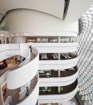 The east atrium is bigger than the one on the west, largely because of its reduced solar exposure, which allows for a more comfortable interior environment. Write-up spaces open onto the atrium, and a spiral staircase connects floors.