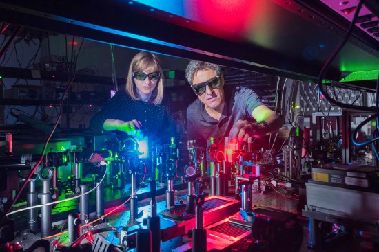 Sandia National Laboratories postdoctoral appointee Polina Vabishchevich, left; and senior scientist Igal Brener made a metamaterial that mixes two lasers to produce 11 colors ranging from the near infrared, through the colors of the rainbow, to ultraviolet.