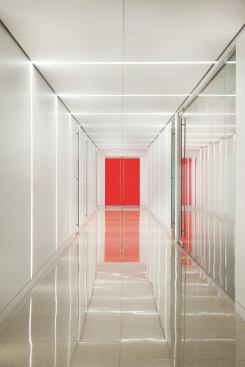 The lighting strategy employs "lines of light" and color planes to create a sense of perspective as people move through the space.