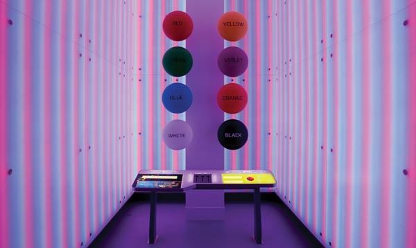 Colors from Light is a 14-foot-tall LED backlit room that teaches guests about wavelengths of light and color mixing. Here we see the interior of the room and the console, which controls the LEDs lights behind frosted acrylic panels, affecting our perception of the color of the disks.