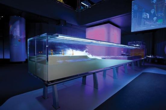 The Tsunmai exhibit explores the force of water. The Light Behavior cube is seen in the background.