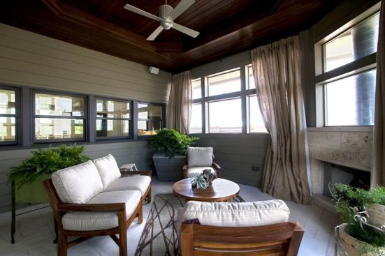 With a built-in fireplace for cooler months, the screened porch can be used year-round.