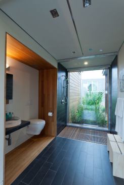 Flush flooring in the bath boosts accessibility.