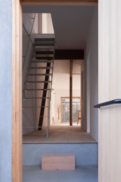 Entrance foyer with view of painted steel stair