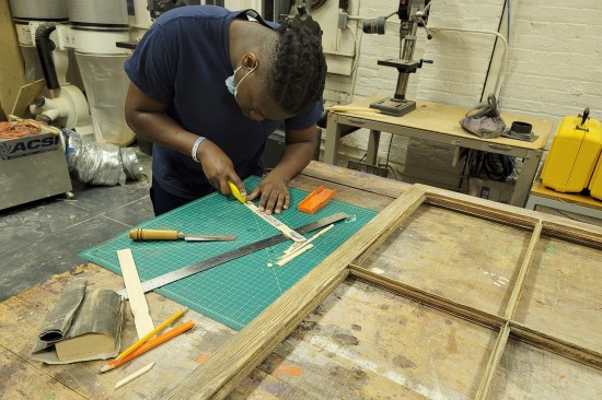 Kenneth Jones helps restore the windows of the Shiloh-Rosenwald School in Notasulga, Ala.
