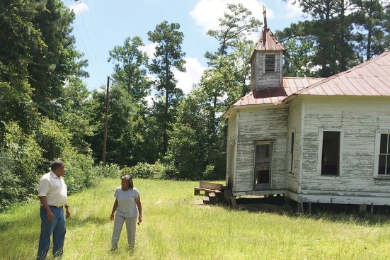 In 2015, freedom colony descendants Gwen Bluiett and Herman Wright lead Andrea Roberts through the Clear Creek Community in Jasper County, Texas, where only church and cemetery remain.