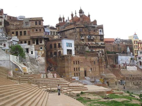 Located on the Ganges, Varanasi is one of India’s major Hindu pilgrimage destinations. Among the oldest continuously populated cities in the world, the city contains many dilapidated structures, including the 18th-century Balaji Ghat, a decaying seven-story wooden temple with steps leading down to the holy river.