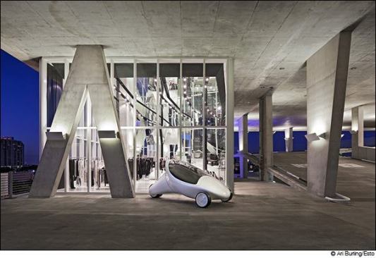 Herzog & de Meuron  Photographer: David Sundberg © Esto  Herzog & de Meuron’s garage, which has hosted weddings and bar mitzvahs, is populated with a menagerie of million-dollar sculptures. Its developer, contemporary art collector Robert Wennet, also commissioned a rooftop penthouse.