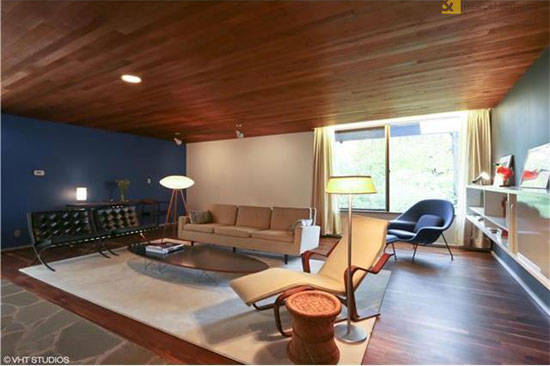 The current owners restored the living room's cedar-plank ceilings and kept much of Breuer's furnishings, including Mies' Barcelona Sofa (left.)