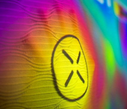 Colors projected onto the textile interface are manipulated by the degree of pressure asserted to SensoryPlayscape's stretchable surface