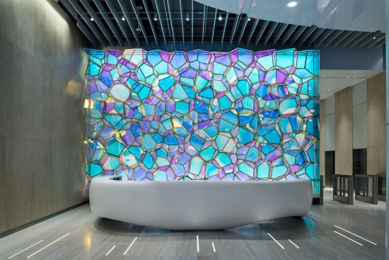 The feature wall's daytime color palette shifts from warm to cool over the course of the day.
