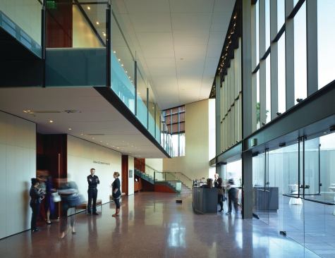 The Bram Goldsmith Theater lobby overlooks a terraced courtyard through a west-facing window wall. 