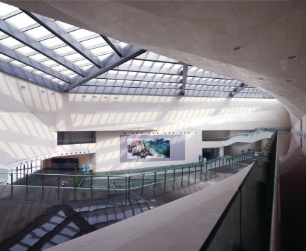 The central atrium, seen here from the third floor, serves as an anchoring space for the museum interior, and is echoed, in plan and section, by an exterior courtyard to the west.