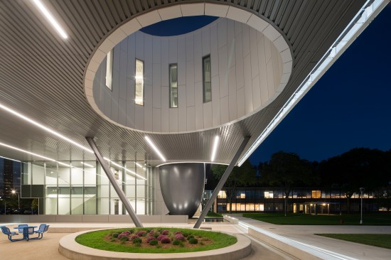A two-story breezeway through the structure forms a new gateway to the quad (at right). An oculus brings daylight to third-floor corridors and conference spaces.