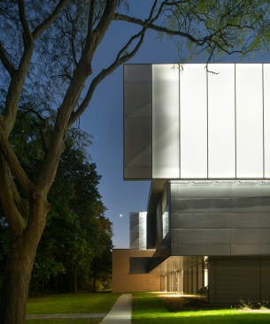 The ETFE scrim wraps much of the third floor, seen here at the building’s northeast corner. The scrim covers clerestory lab windows and, when backlit, transforms the building at night.