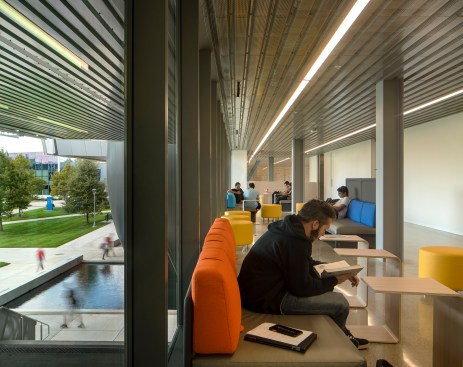 Hallways running the length of the building, like this one on the second level, are programmed with breakout spaces for students to collaborate, and give access to all of the facilities in the new complex, including the Marburger STEM Center, which supports the development of new science and technology programs for the university.