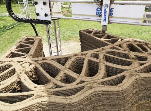 TECLA 3D printed earth wall section by Crane WASP