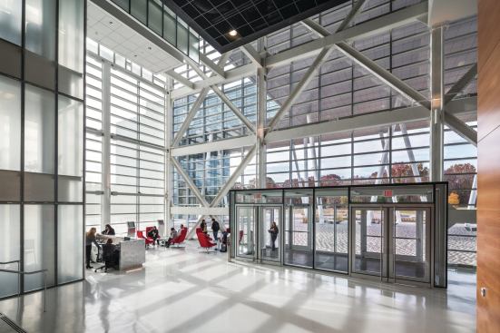 The main pedestrian lobby is located under the bridge, in the western wing of the building. 