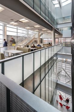 Additional lounge and breakout spaces are located throughout the building, especially around the main atrium in the western wing.