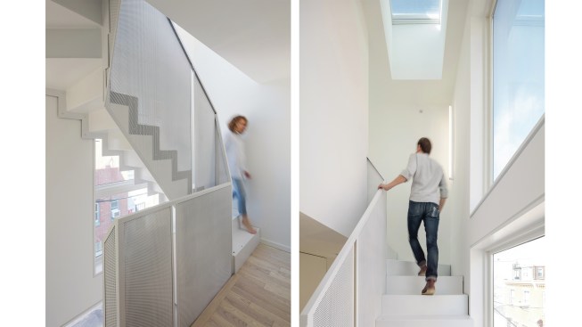 A custom metal stair by En-Motion Designs connects the floors at the front of the house; perforated metal baluster panels ensure that daylight from the front windows is still able to enter the living spaces. 