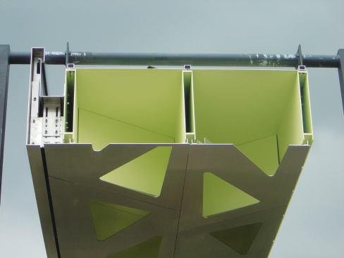 Laser-cutting, welding, bolting, and pre-cambering produced a mass customized steel roof that is 50 cm (nearly 20 inches) deep.