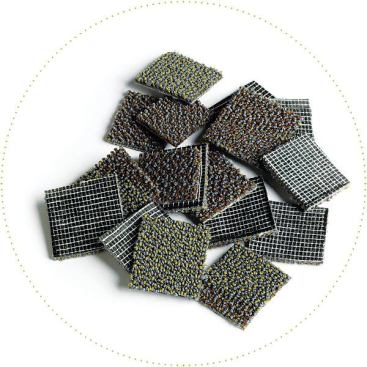Carpet to be recycled is chopped into pieces