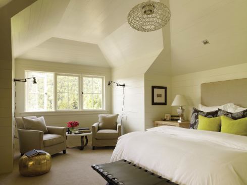 The master bedroom's horizontal paneling hints at the attic it once was.

