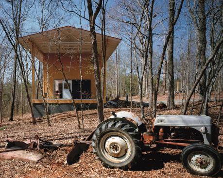 This live/work space for two artists in Saxaphaw, N.C., accommodates their disparate needs with two double-height studios separated by a shared wood shop.