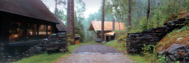 Residential Architect  July 2005  Light From Both Sides   The approach to Ravenwood studio cuts through a wall of dry-laid taconite and continues into the heart of the complex, which is clustered like a tiny Scandinavian village.