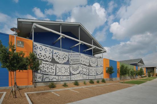 Wall murals by Carmen Lomas Garza depict papel picado, a Mexican cut-paper folk art, as well as provide decoration for the 500-foot sound wall.