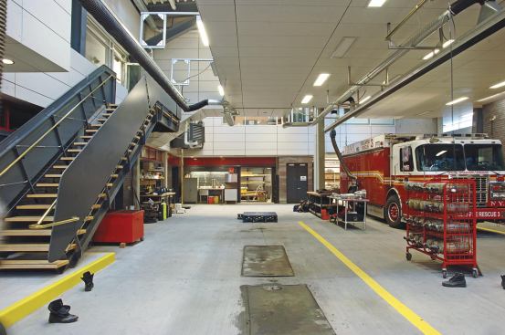In the base for Rescue Company 3 there is space for apparatus, house watch, workshops, and storage. Celestory windows and skylights are used where normal windows wouldn't offer privacy and security.