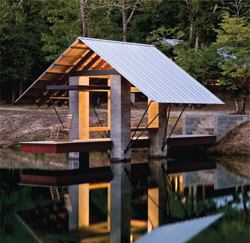 CHDA 2008 – Accessory Building / Grand Award Architect: Robert M. Cain, Architect, Atlanta; Builder: Brunson Construction Co., Hampton, S.C.   The project consists mostly of the same materials used on the main house—salvaged wood, steel beams, and a standing seam metal roof. From a distance, the overall effect is that of a little house with transparent walls. The owners use the dock for activities such as fishing, boating, and swimming. But its most important function is providing a spot to just sit and enjoy the beauty of the site.