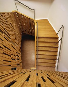 CNC-fabricated bamboo paneling in staircase