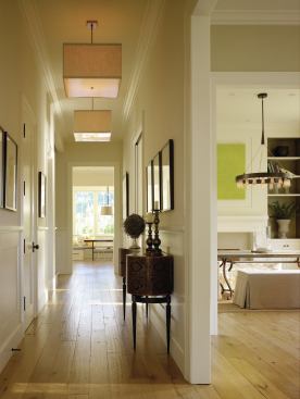 New, taller doorways maximize the penetration of natural light. An eclectic mix of lighting fixtures adds a contemporary touch.

