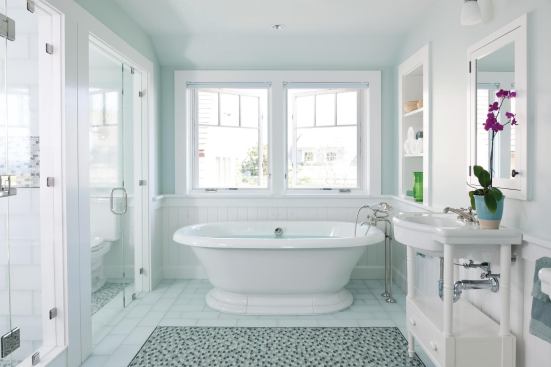 In this Cape Cod, Mass., bath designed by Hutker Architects and Eileen Peretz Interiors, a glass tile mosaic pattern adds interest underfoot.