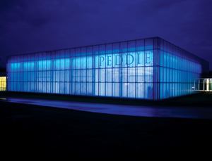 The illumination scheme for the athletic center's façade does more than just highlight the architecture, it let's people know when the swim team has had a successful swim meet. Victory is signaled by the appearance of the school's color—Peddie blue—achieved with blue T5HO linear fluorescents controlled separately.